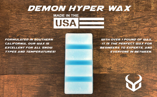 Demon Hyper Wax packaging with text on a wooden background