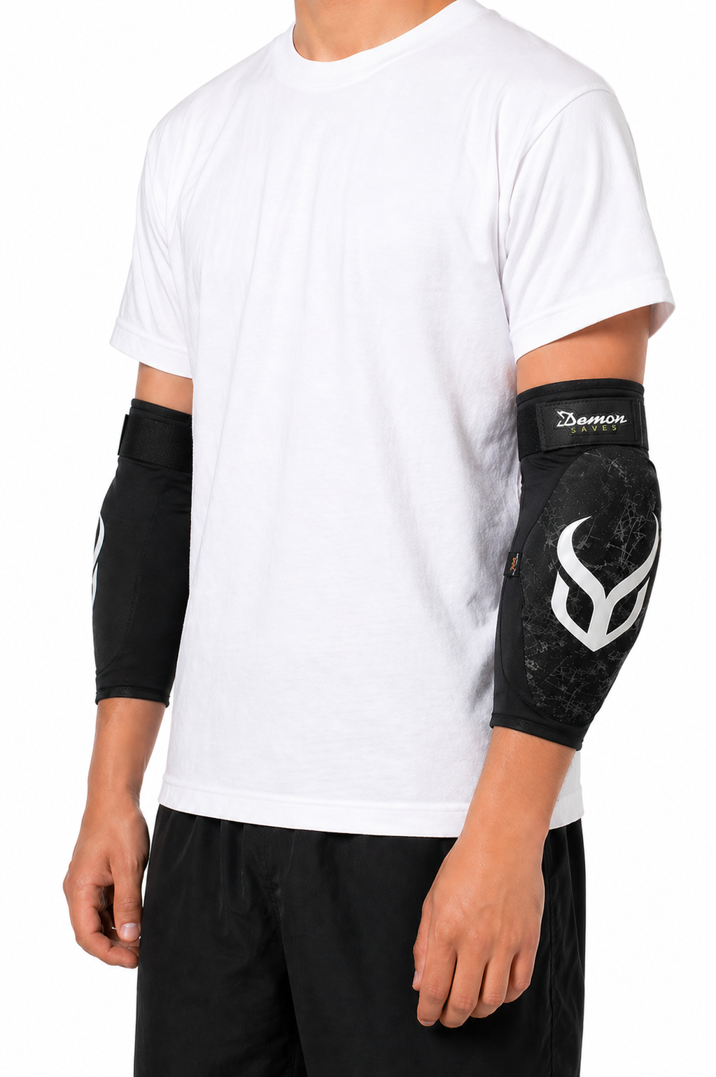Person wearing black elbow pads with a logo on a white background