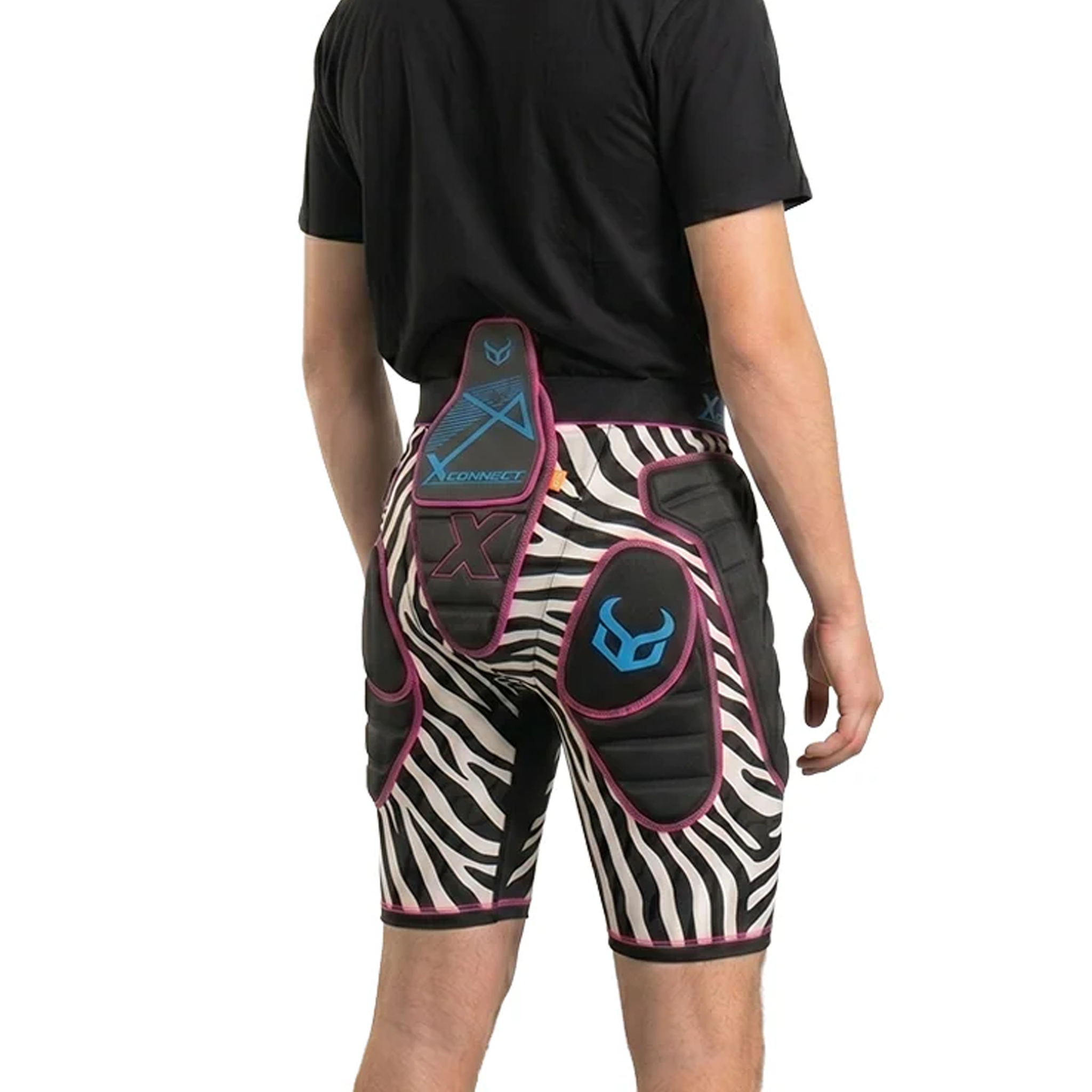 Person wearing black and white zebra-patterned shorts with blue and pink accents on a white background