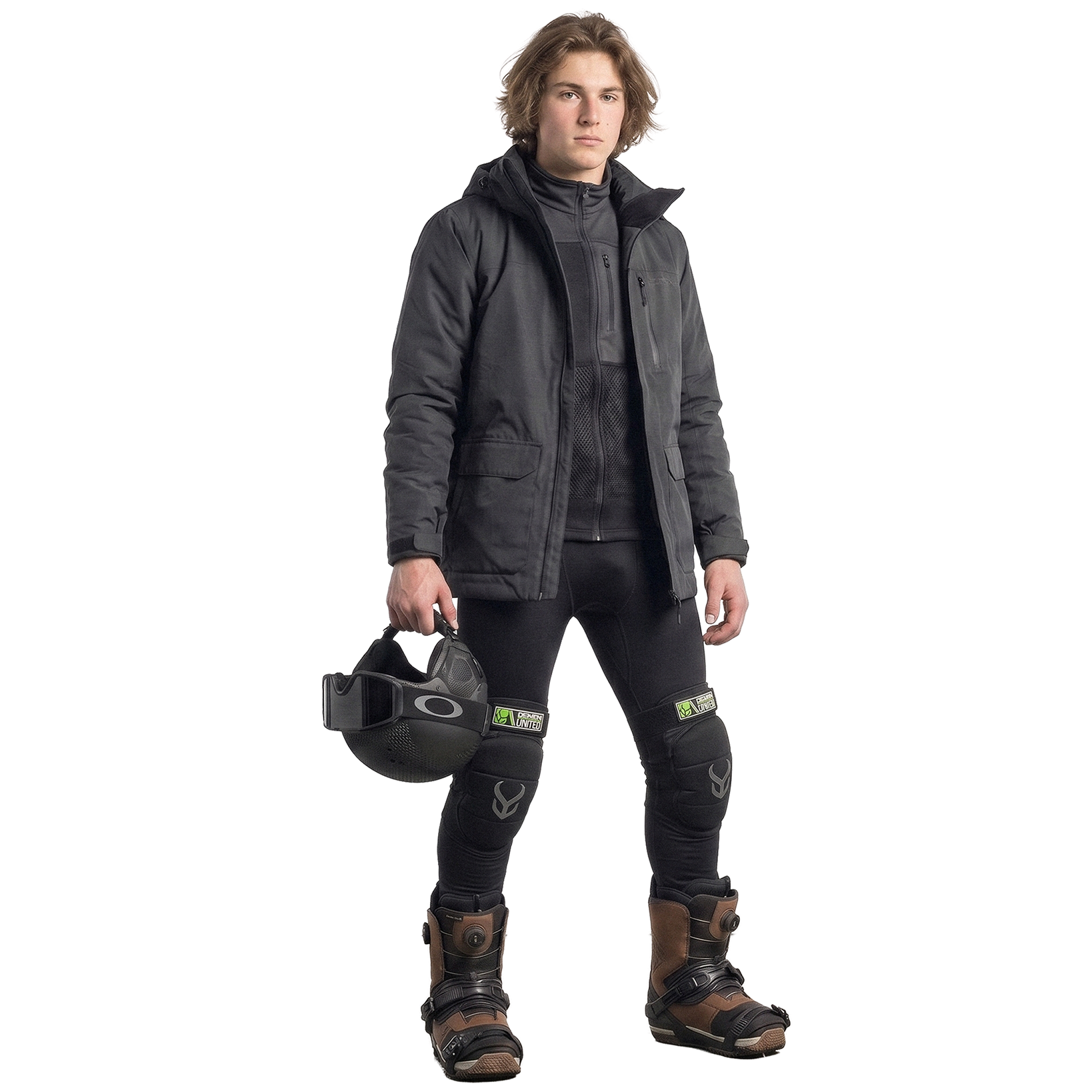 Person wearing a dark jacket, pants, and boots holding a helmet on a white background