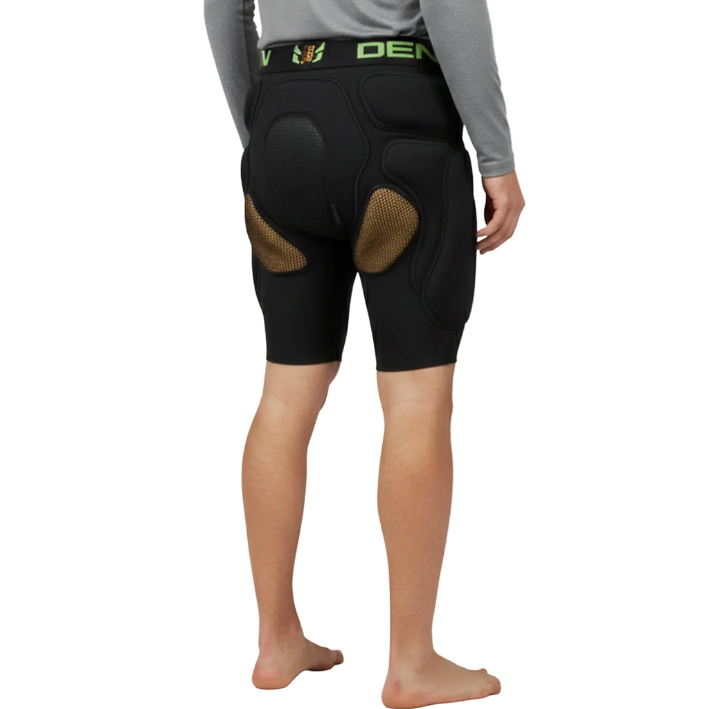 Person wearing black protective shorts with padding on a white background