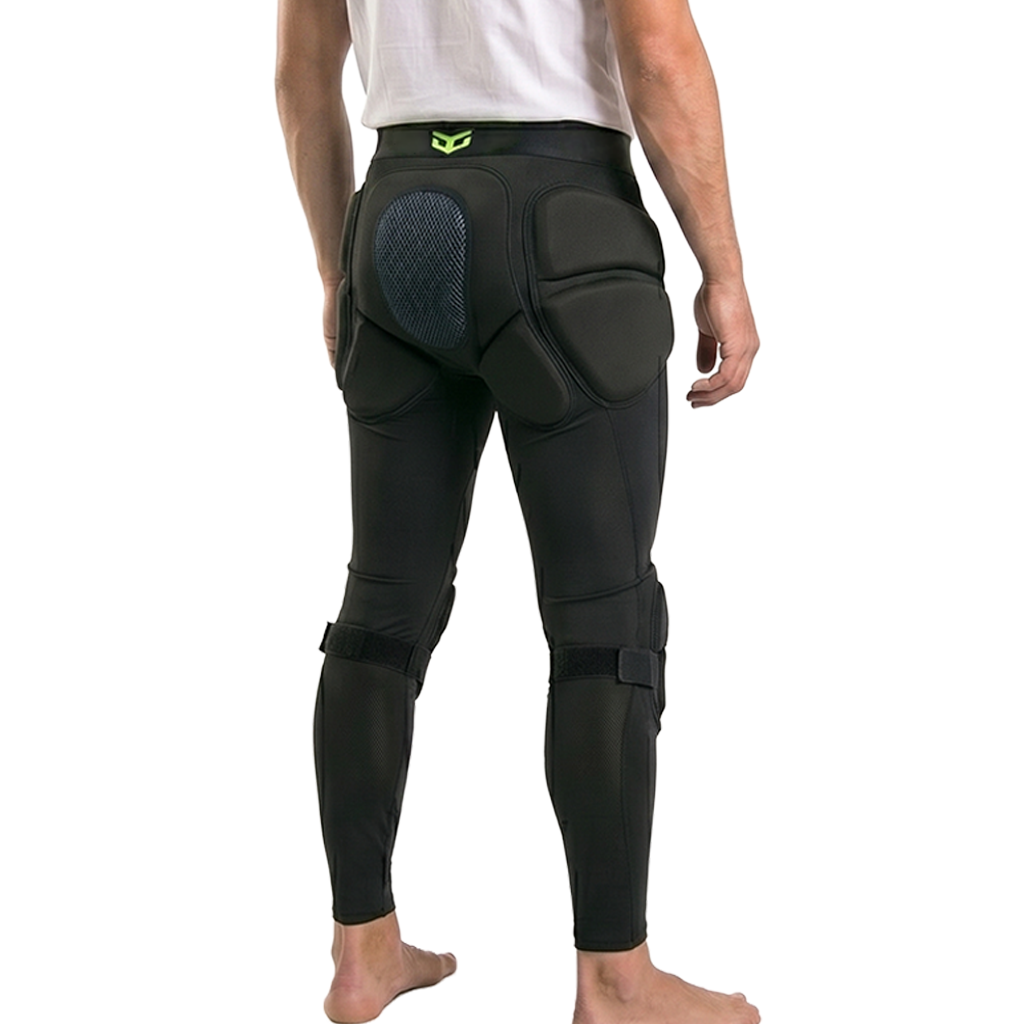 Person wearing black protective pants with padding on a white background
