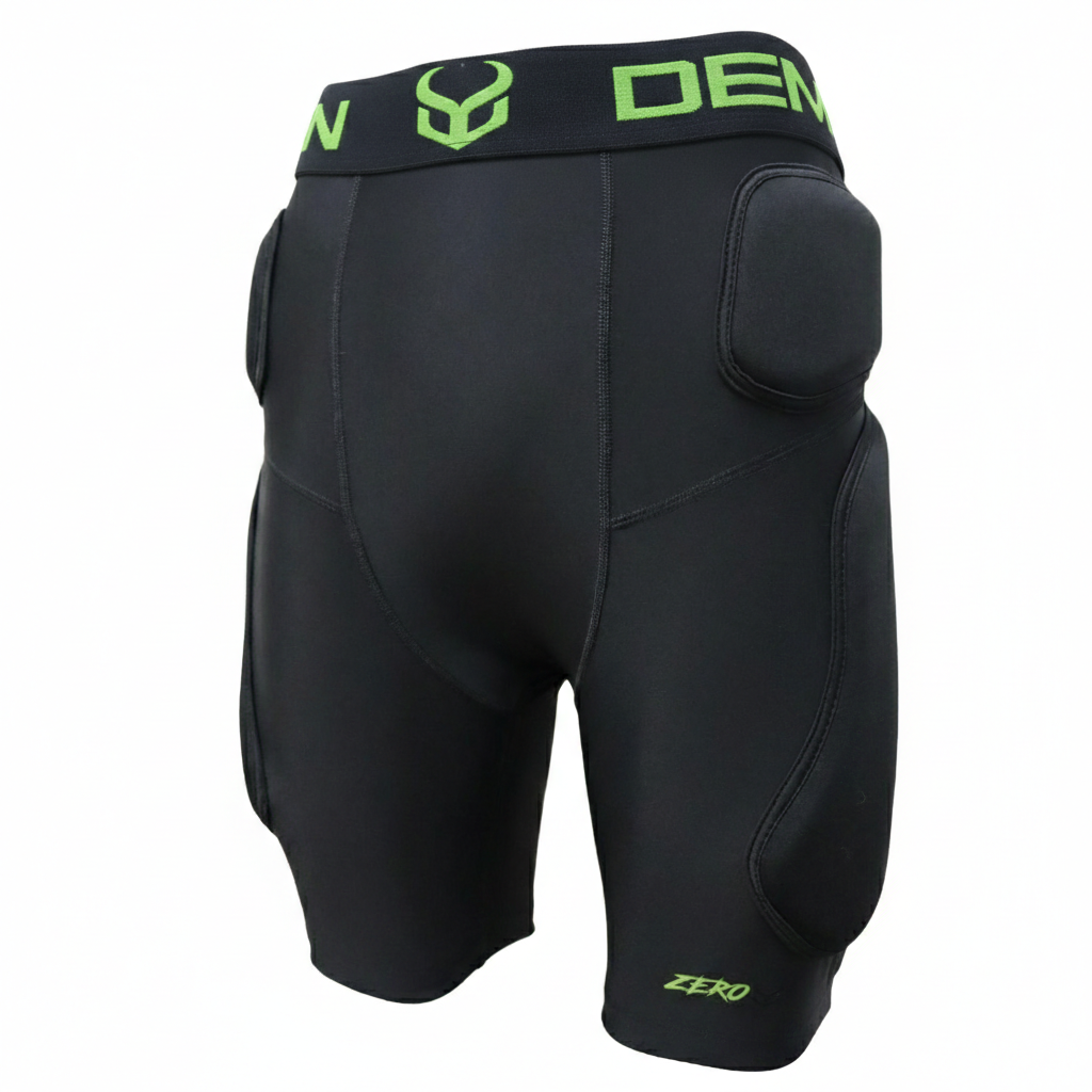 Black protective athletic shorts with green branding on a white background
