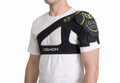 Person wearing a black shoulder brace with visible branding on a white background
