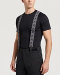 Model wearing Demon Snow Suspenders clipped to padded snowboard shorts