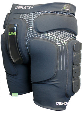 A rear view of black padded shorts featuring a heavy-duty, multi-segmented tailbone shield and reinforced glute and hips padding, accented by a geometric grid design and a secure elastic waistband.