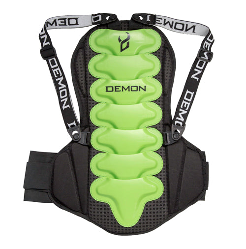A spine guard for snowboarding, featuring a black outer shell with green padding and the brand name 'DEMON' written across the straps.